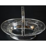A George III Old Sheffield Plate oval swing-handled cake dish, pierced and engraved in the Neo-