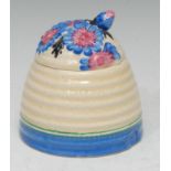 A Clarice Cliff Marguerite pattern beehive shaped honey pot and cover, the cover in relief with blue