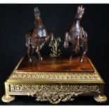 Continental School, a dark patinated bronze equestrian group, of a pair of rearing horses,