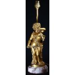 A Louis XVI style gilt bronze figural table lamp, cast as a scantily clad putto, circular marble