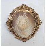 A 19th century carved shell cameo brooch in deep relief, as Zeus in profile above his messenger