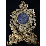 A Louis Philippe ormolu cartouche shaped mantel clock, 10cm silvered dial inscribed with Roman