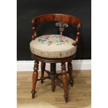 A William IV mahogany cellist's stool, curved back rail carved with scrolling lotus and draught-