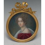A Continental porcelain circular plaque, painted with a portrait miniature of a lady of title,