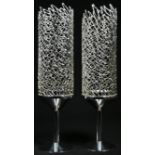 Stuart Devlin (1931 - 2018) - a pair of Elizabeth II silver candlesticks, textured filigree
