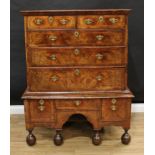 A Queen Anne walnut chest on stand, crossbanded top above two short and three long graduated