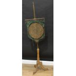 A 19th century giltwood and brass tripod pole screen, by W.Homann and Son, London W., label, urnular