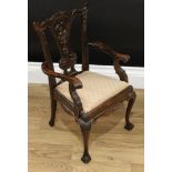 A Chippendale Revival mahogany child's chair, carved back, splat and arms, drop-in seat, ball and