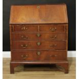 A late 18th century Dutch mahogany bureau, fall front enclosing a cupboard and a stepped arrangement