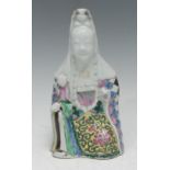 An 18th century Chinese porcelain figure, of Guanyin and child, their heads Blanc de Chine, the