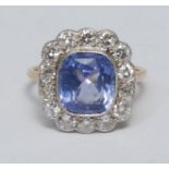 A diamond and natural colour change sapphire cluster ring, large central Sri Lankan cushion cut pale