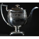 A George III silver boat shaped pedestal coffee pot, hinged domed cover with fluted knop finial,