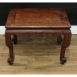 A Chinese hardwood rectangular low tea table, oversailing top above a shaped frieze carved with