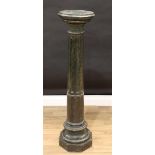 A 19th century serpentine statuary pedestal, circular top, fluted pillar, octagonal base, 110cm
