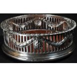 An Adam Revival silver circular wine coaster, chased and pierced in the Neoclassical taste with