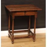 A William III design oak side table, oversailing top above a frieze drawer, cast brass drop