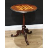 A Victorian walnut tripod games table, circular top inlaid for chess, turned and fluted pillar,