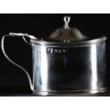 A George III silver oval mustard, hinged domed cover with ball finial, scroll handle, reeded