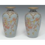 A pair of late 19th century Langley Ware vases, incised with rosehips and foliage, the neck with