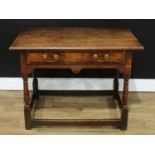 An 18th century oak rectangular side table, oversailing top above a crossbanded frieze drawer,