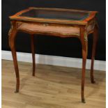 A 19th century French gilt metal mounted rosewood serpentine bijouterie table, hinged top with