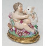 A French gilt metal mounted bonboniere, modelled with cherub and lamb, the cover and interior with