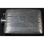 An American silver rounded rectangular hip flask, engine-turned in vertical bands, hinged screw-