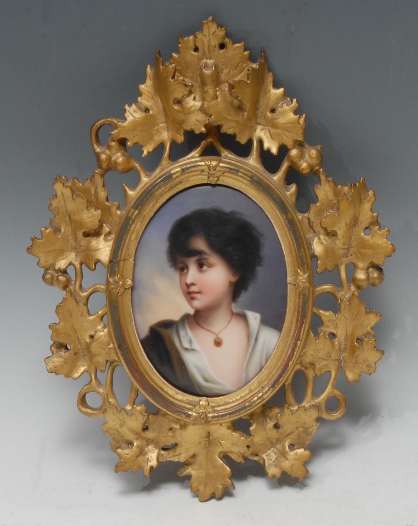 A Berlin type oval plaque, of a young child, wearing a necklace and open necked shirt, 13cm x 9cm,