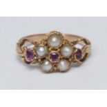 An 18th century style pearl and ruby floral cluster ring, five mabe pearls surrounding a central