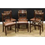 A set of six George IV mahogany bar-back dining chairs, each central rail carved with a lotus