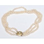 A cultured pearl three strand choker necklace, three uniform strands of creamy white cultured