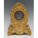 A French Louis Philippe Rococo Revival ormolu cartouche shaped mantel clock, 7c.5m circular silvered