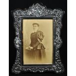 A Victorian silver and tortoiseshell shaped rectangular easel photograph frame, the mount pierced