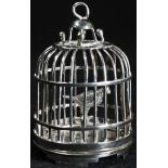 A Chinese silver miniature toy model, of a bird in a cage, 6cm high, maker SC, early 20th century