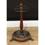 Theodore Alexander - a Victorian style circular walking stick stand, brass restraint with four