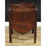 A George III mahogany tray-top night table, shaped gallery above a pair of doors and a commode