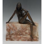 An Art Deco bronze figure, of an elegant lady, seated on a marble wall, 23cm high