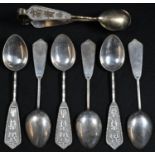 A set of six Chinese silver teaspoons and sugar tongs en suite, their respective handles and bows in