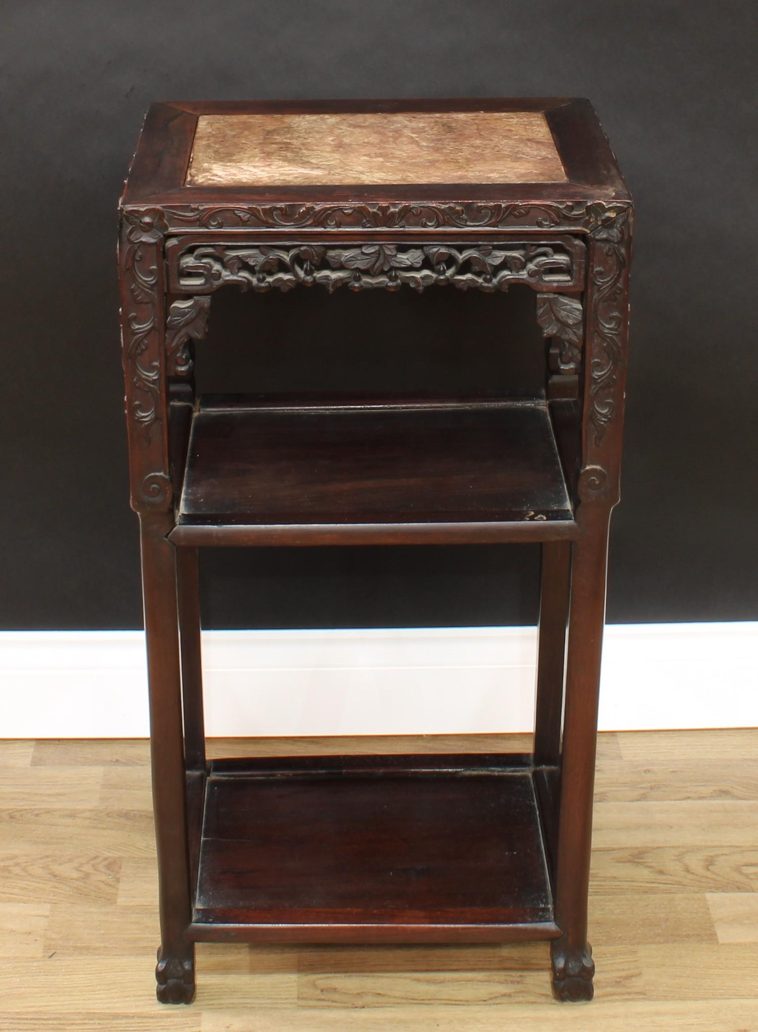 A 19th century Chinese hardwood rectangular vase stand, the top with inset soapstone panel above two