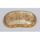 A porcelain panel brooch, undulating shaped gilt floral panel, collar set within a textured 15ct