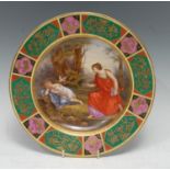 A Vienna circular cabinet plate, of Honour and Elgenius, the border with emerald panels applied with