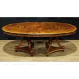 A George III style oval dining table, by repute purchased from Harrods, moulded top with two batwing