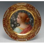 A Royal Vienna style cabinet plate, Cacilie, decorated with a beauty from the back, bust length, the