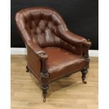 A Victorian mahogany library chair, deep-buttoned stuffed-over upholstery, turned and carved
