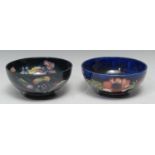 A Moorcroft Anemone pattern bowl, tubed lined with large flowerheads on a blue ground, 15.5cm