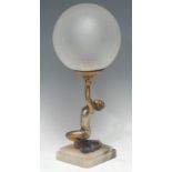 An Art Deco silvered and gilt metal figural table lamp, as a dancer balancing a ball, globular
