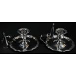 A pair of George II style silver chambersticks, shaped detachable nozzles, slightly fluted