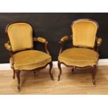A pair of French Hepplewhite design rosewood elbow chairs, arched backs, serpentine arms carved with
