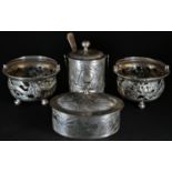 A Chinese silver oval box and cover, chased with leafy bamboo on a textured ground, 10.5cm wide,