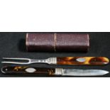 A George III silver and tortoiseshell travelling knife and fork, each folding for the pocket, 14cm